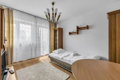 Łóżko lub łóżka w pokoju w obiekcie Bielany Standard Apartment by BookingHost