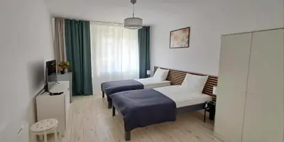 Łóżko lub łóżka w pokoju w obiekcie Laurens Apartment