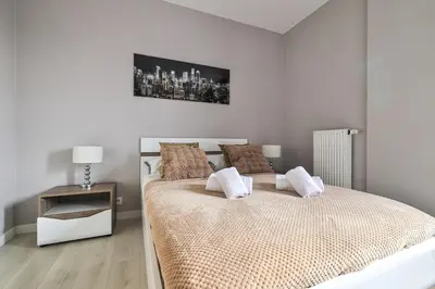 Łóżko lub łóżka w pokoju w obiekcie Grochowska 207 Rondo Wiatraczna by PerfectApart
