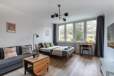 Łóżko lub łóżka w pokoju w obiekcie Cosy Family Apartment by VAYA STAYS