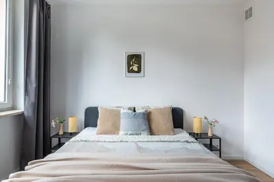 Łóżko lub łóżka w pokoju w obiekcie Cosy Family Apartment by VAYA STAYS