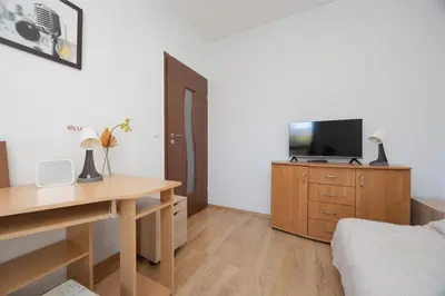 Telewizja i/lub zestaw kina domowego w obiekcie Obywatelska Comfort Apartment by Solarento