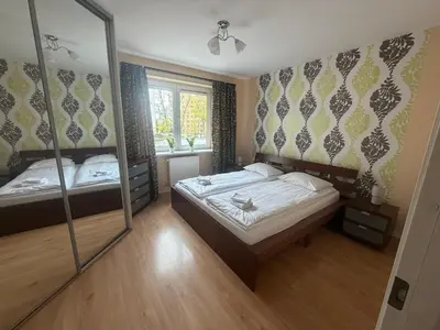 Łóżko lub łóżka w pokoju w obiekcie Metro Kondratowicza Apartment Malborska Targówek Warsaw