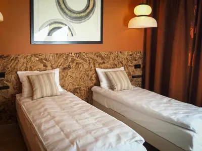 Łóżko lub łóżka w pokoju w obiekcie Enjoy Warsaw - home cinema