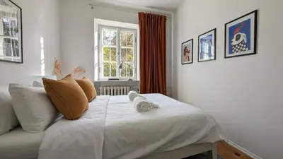 Łóżko lub łóżka w pokoju w obiekcie Bella Luna Luxury Suites - Chic Old Town Warsaw Apartment