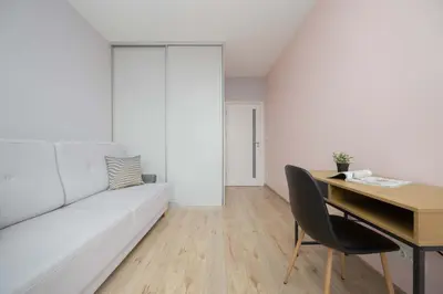 Łóżko lub łóżka w pokoju w obiekcie Cozy Apartment for 8 People with Air Conditioning and 2 Parking Spaces by Noclegi Renters