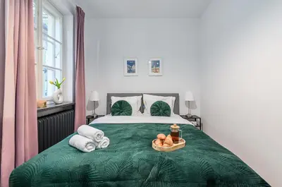 Łóżko lub łóżka w pokoju w obiekcie Lumina 3-room apart near the royal castle
