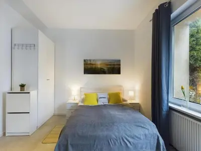 Łóżko lub łóżka w pokoju w obiekcie Nice Studio w Garden & Parking near Warsaw Airport