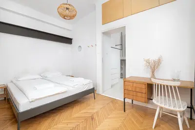 Łóżko lub łóżka w pokoju w obiekcie RentPlanet - Apartament Krucza