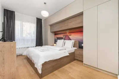 Łóżko lub łóżka w pokoju w obiekcie Apartament Jeziorańskiego by Your Freedom