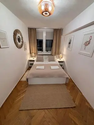 Łóżko lub łóżka w pokoju w obiekcie Elegant Apartment Warsaw Panorama