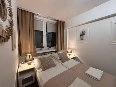 Łóżko lub łóżka w pokoju w obiekcie Elegant Apartment Warsaw Panorama
