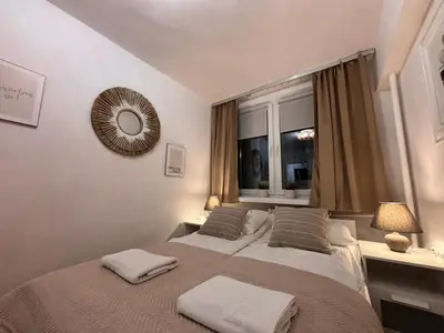 Łóżko lub łóżka w pokoju w obiekcie Elegant Apartment Warsaw Panorama