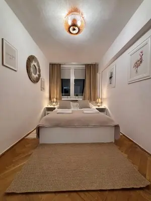 Łóżko lub łóżka w pokoju w obiekcie Elegant Apartment Warsaw Panorama