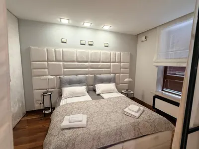 Łóżko lub łóżka w pokoju w obiekcie Apartament w samym centrum z parkingiem, Bagno 2 by OhMyHome