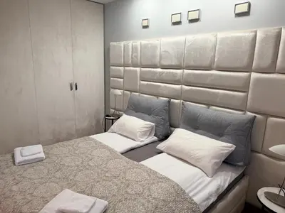 Łóżko lub łóżka w pokoju w obiekcie Apartament w samym centrum z parkingiem, Bagno 2 by OhMyHome