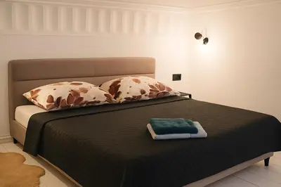 Łóżko lub łóżka w pokoju w obiekcie Nowoczesny Loft przy Starówce Daniłowiczowska 18
