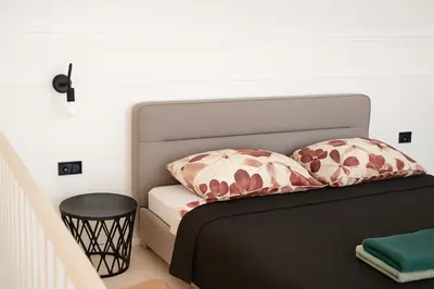 Łóżko lub łóżka w pokoju w obiekcie Nowoczesny Loft przy Starówce Daniłowiczowska 18