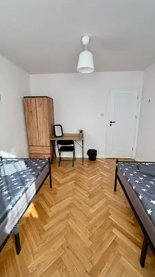 Łóżko lub łóżka w pokoju w obiekcie Rooms in Warsaw - P13-19