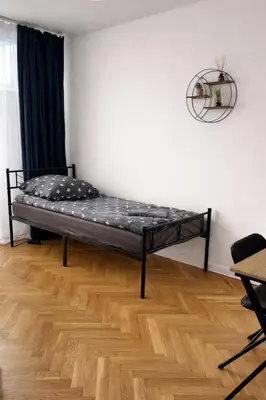 Łóżko lub łóżka w pokoju w obiekcie Rooms in Warsaw - P13-19