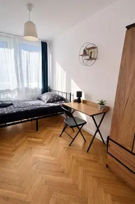 Łóżko lub łóżka w pokoju w obiekcie Rooms in Warsaw - P13-19
