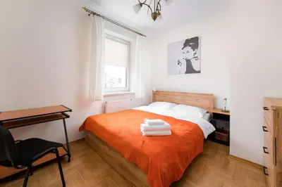 Łóżko lub łóżka w pokoju w obiekcie Bemowo Spacious Apartment by BookingHost