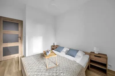 Łóżko lub łóżka w pokoju w obiekcie Warsaw Wola Suites - Parking, Workspace, Terrace - by Rentujemy