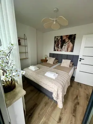 Łóżko lub łóżka w pokoju w obiekcie SPV Rentals Pileckiego 59 lokal 258 Ursynów