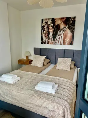 Łóżko lub łóżka w pokoju w obiekcie SPV Rentals Pileckiego 59 lokal 258 Ursynów