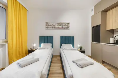Łóżko lub łóżka w pokoju w obiekcie Bemovia House