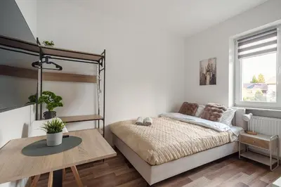 Łóżko lub łóżka w pokoju w obiekcie Bemovia House