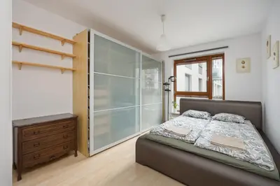 Łóżko lub łóżka w pokoju w obiekcie Apartament Branickiego