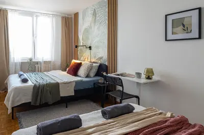 Łóżko lub łóżka w pokoju w obiekcie Majdańska Apartment Warsaw by Mia