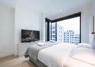 Łóżko lub łóżka w pokoju w obiekcie Towarowa Square Residence
