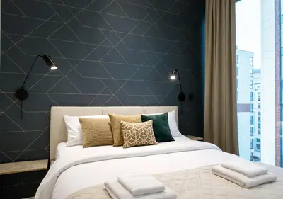 Łóżko lub łóżka w pokoju w obiekcie Towarowa Square Residence