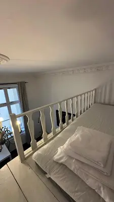Łóżko lub łóżka w pokoju w obiekcie Kamienica Śródmieście Apartament 19A