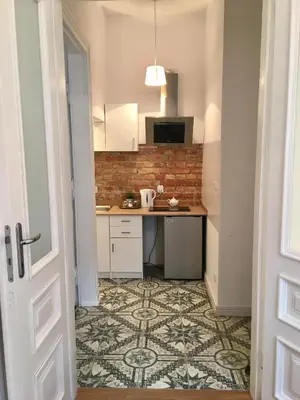 Kuchnia lub aneks kuchenny w obiekcie Kamienica Śródmieście Apartament 19A