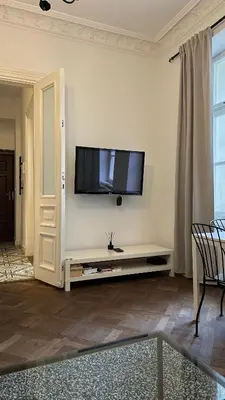 Telewizja i/lub zestaw kina domowego w obiekcie Kamienica Śródmieście Apartament 19A