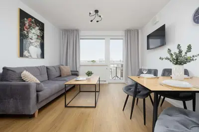 Część wypoczynkowa w obiekcie Ursynów Apartment with Desk & Balcony by Noclegi Renters