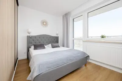 Łóżko lub łóżka w pokoju w obiekcie Ursynów Apartment with Desk & Balcony by Noclegi Renters