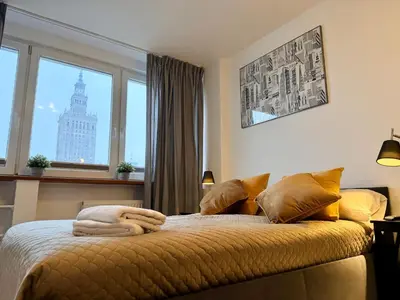 Łóżko lub łóżka w pokoju w obiekcie Cozy Morden Studio, Bagno 5 by OhMyHome