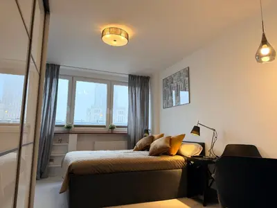 Łóżko lub łóżka w pokoju w obiekcie Cozy Morden Studio, Bagno 5 by OhMyHome