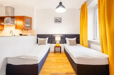 Łóżko lub łóżka w pokoju w obiekcie Nowy Świat Quiet Apartment