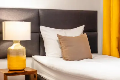 Łóżko lub łóżka w pokoju w obiekcie Nowy Świat Quiet Apartment