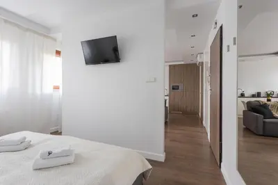 Łóżko lub łóżka w pokoju w obiekcie Close-Urban Apartaments - Great Location - City Center - Wronia В
