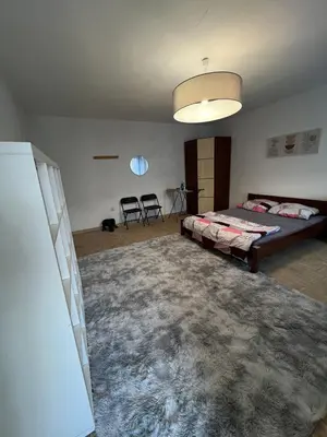 Łóżko lub łóżka w pokoju w obiekcie Stayo Apartments - Warsaw city center