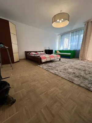 Łóżko lub łóżka w pokoju w obiekcie Stayo Apartments - Warsaw city center