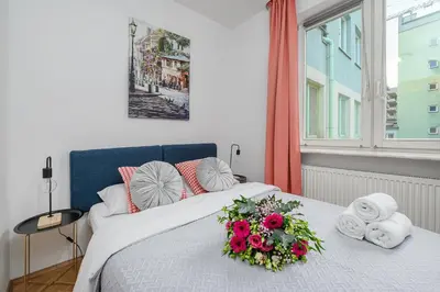 Łóżko lub łóżka w pokoju w obiekcie Lumina apartment for family in center Warsaw