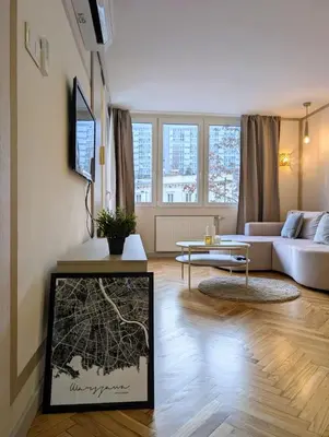 Telewizja i/lub zestaw kina domowego w obiekcie The Golden Frame by Cooee Apartments