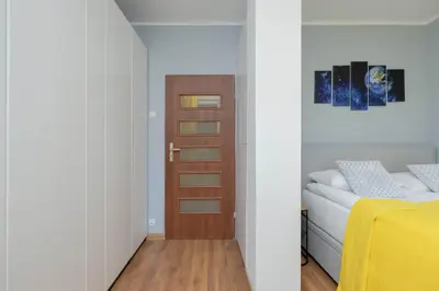 Łóżko lub łóżka w pokoju w obiekcie Unique Apartment with Air Conditioning and Underground Parking by Noclegi Renters
